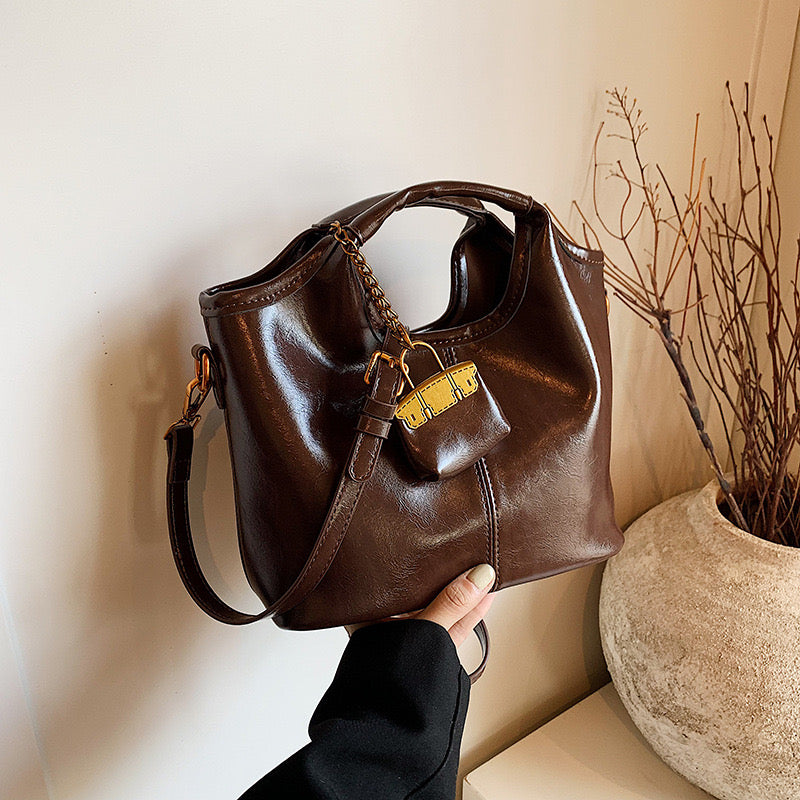 Hand-held bucket bag with small bag hanger